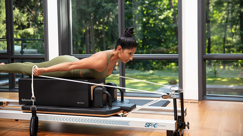 Student on Reformer with Reformer Box