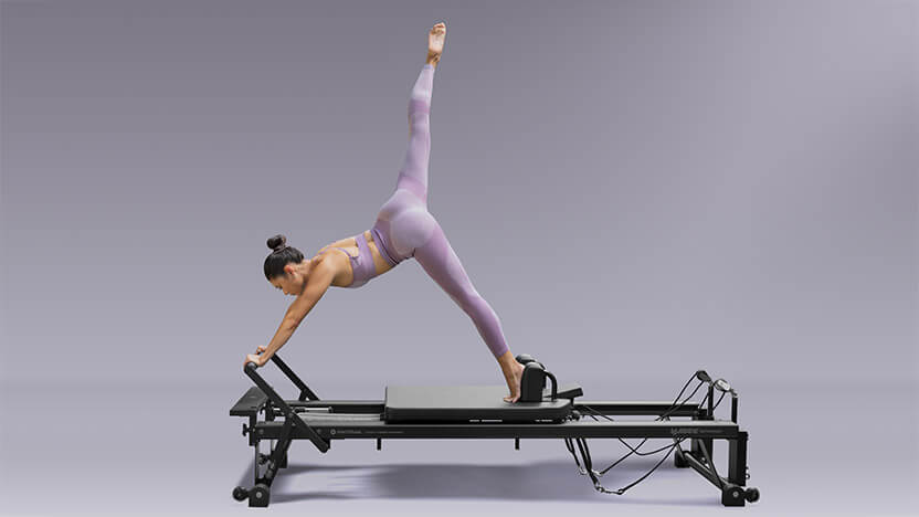 Student stretching on V2 Max Reformer