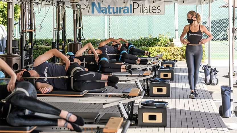 Laura Wilson, owner of Natural Pilates in Los Angeles, California, teaches a group class on the Merrithew V2 Max Plus Reformers