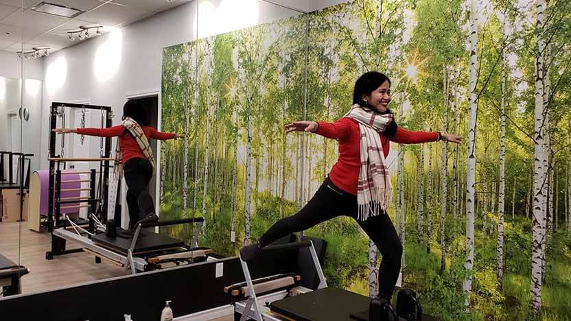 A STOTT PILATES Certified Instructor practices Pilates on the Merrithew V2 Max Plus Reformer at a Pilates studio in the Philippines